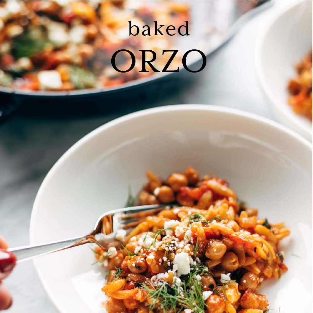 Bowl of baked orzo with a fork, text overlay 'baked ORZO'.