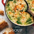 Orzo soup in a pot with bread on the side