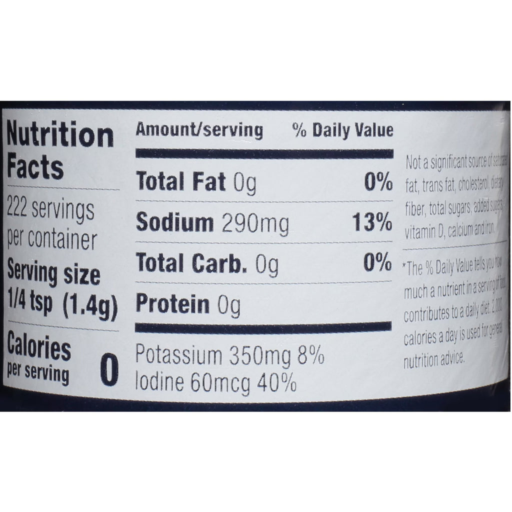 A close-up of a nutrition facts label showing serving size, calories, and nutrient content including total fat, sodium, total carbohydrate, and protein per serving.