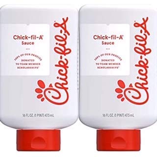 Two 16 fl oz bottles of Chick-fil-A Sauce side by side