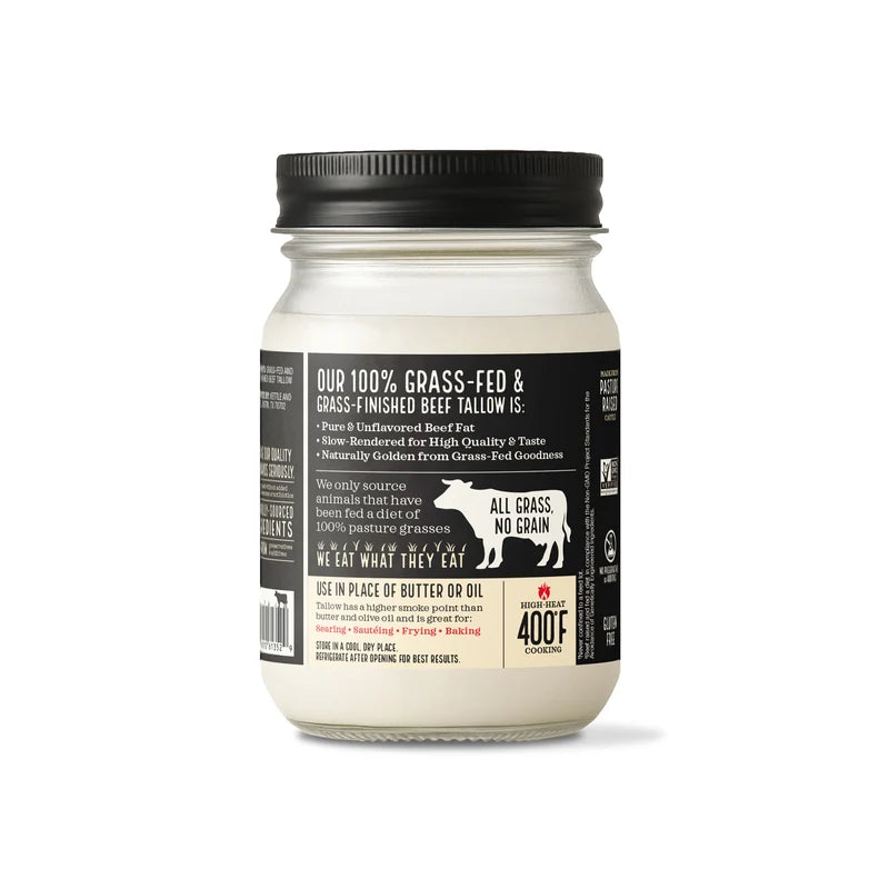 A glass jar of grass-fed beef tallow with a black lid and a black label, shown against a plain white background.