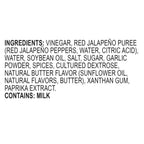A text-only label on a white background listing ingredients for a red jalapeño puree product, including vinegar, water, soybean oil, salt, sugar, garlic powder, spices, cultured dextrose, natural butter flavor, xanthan gum, and paprika extract. It also states 'CONTAINS: MILK'.