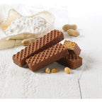 Chocolate wafers with peanuts on a white surface